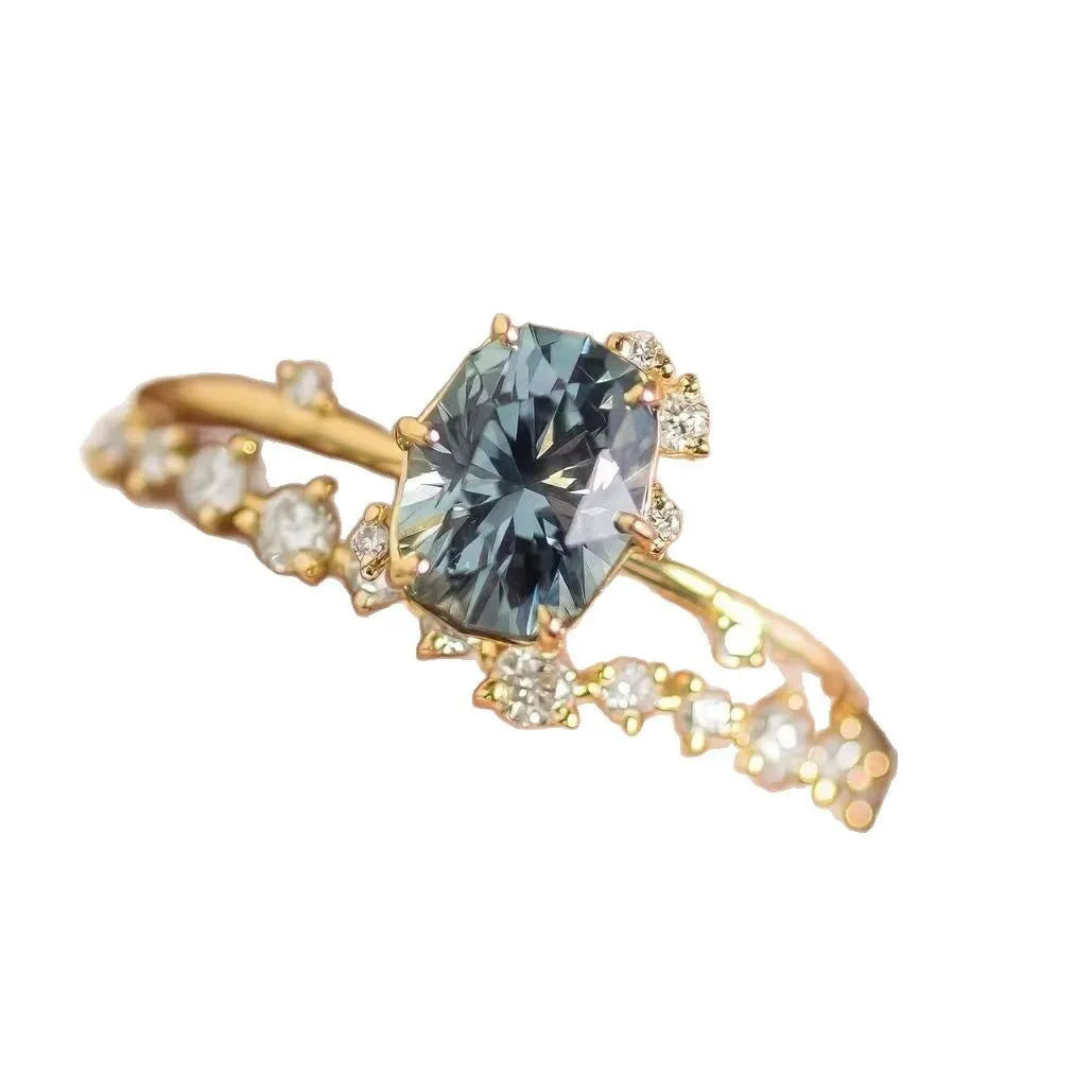 Gold plated women's ring with green zircon stones in floral design, shown as a pair for couple wear