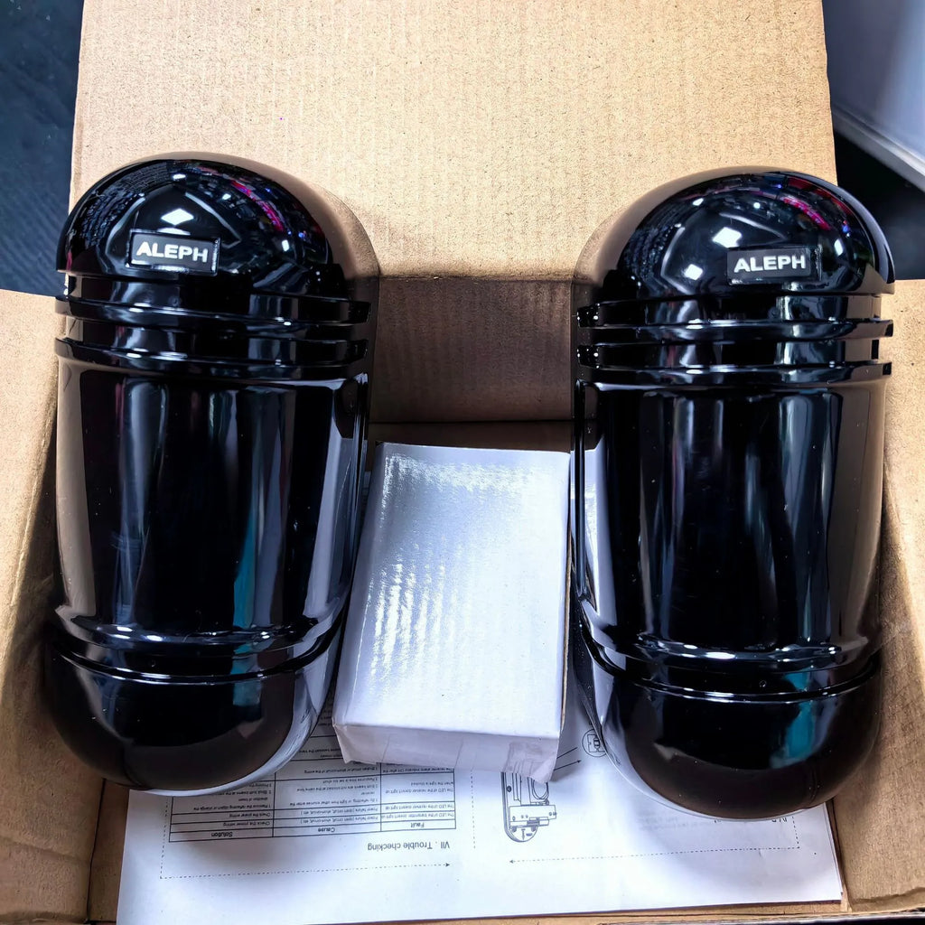 A pair of black infrared detector units for a wired anti-theft alarm system with a 150-metre range.