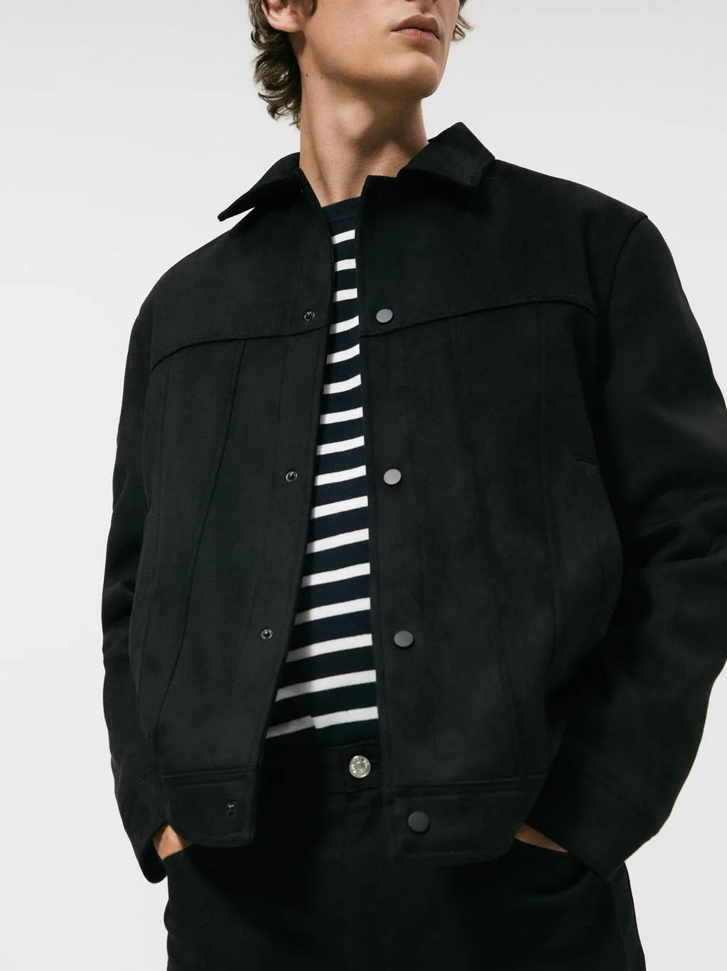 Black men's hooded casual jacket with a suede collar, showing side seam pockets and loose long sleeves.