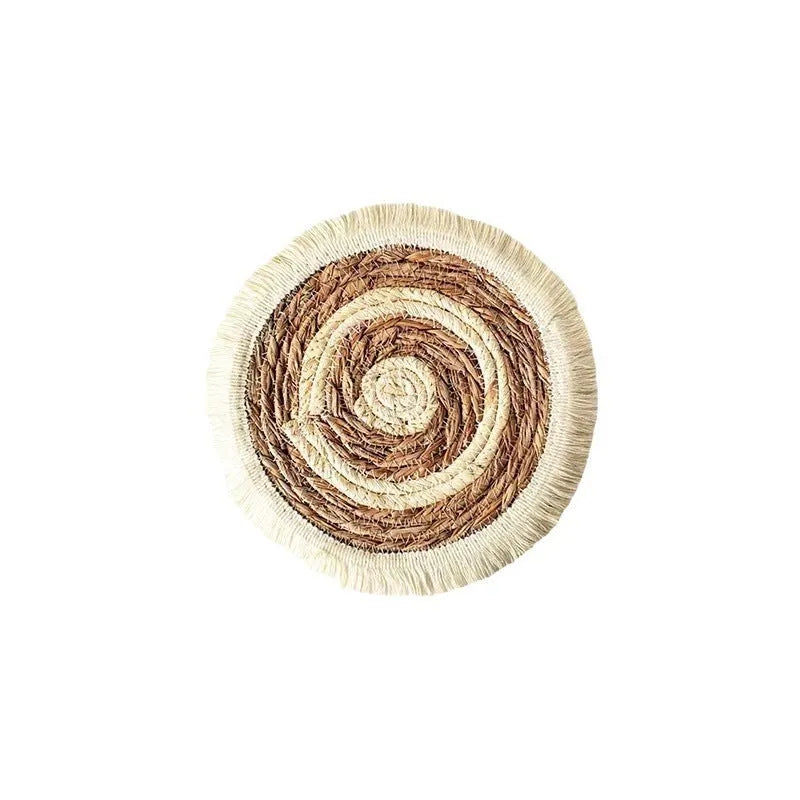 Round Japanese placemat made from natural papyrus with decorative tassels in modern simple style