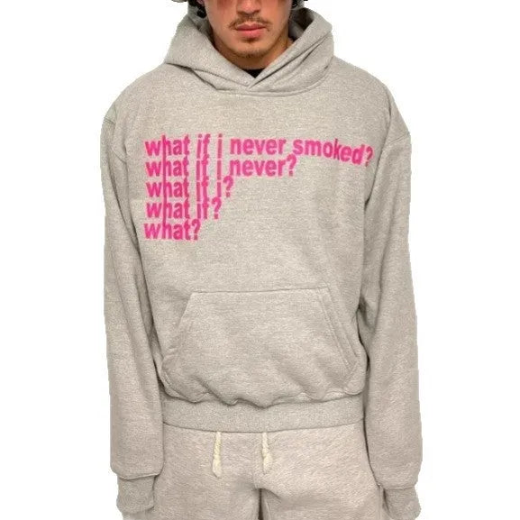 Black hooded sweater with white letter print on the front, shown on a model.