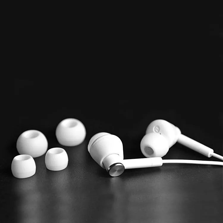 Wired in-ear earphones with subwoofer for computer and mobile phone, shown in Black and White