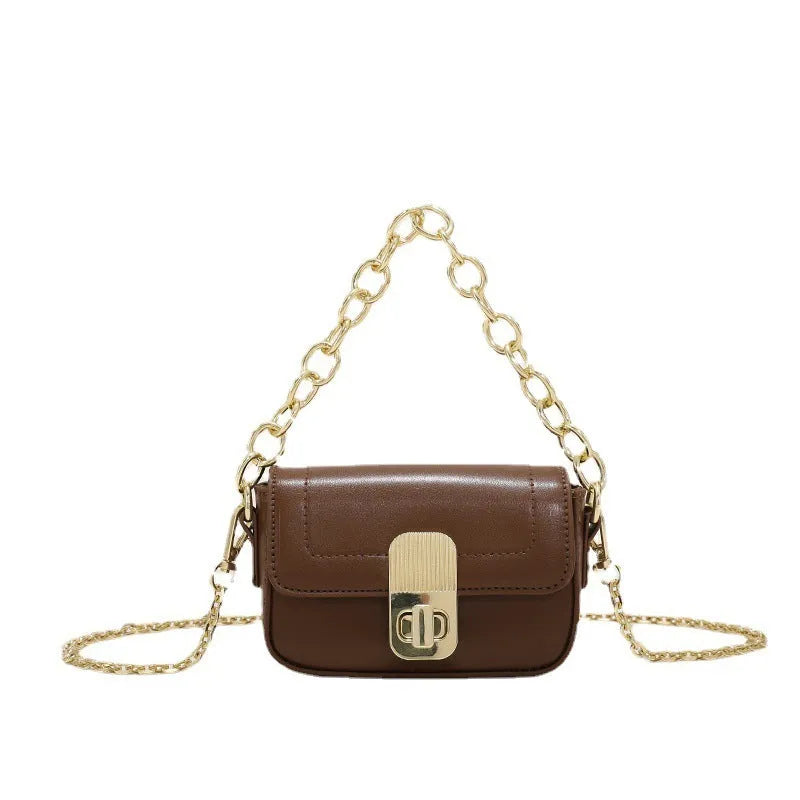 Niche chain shoulder messenger phone bag in horizontal square shape with soft handle and lock detail in PU material
