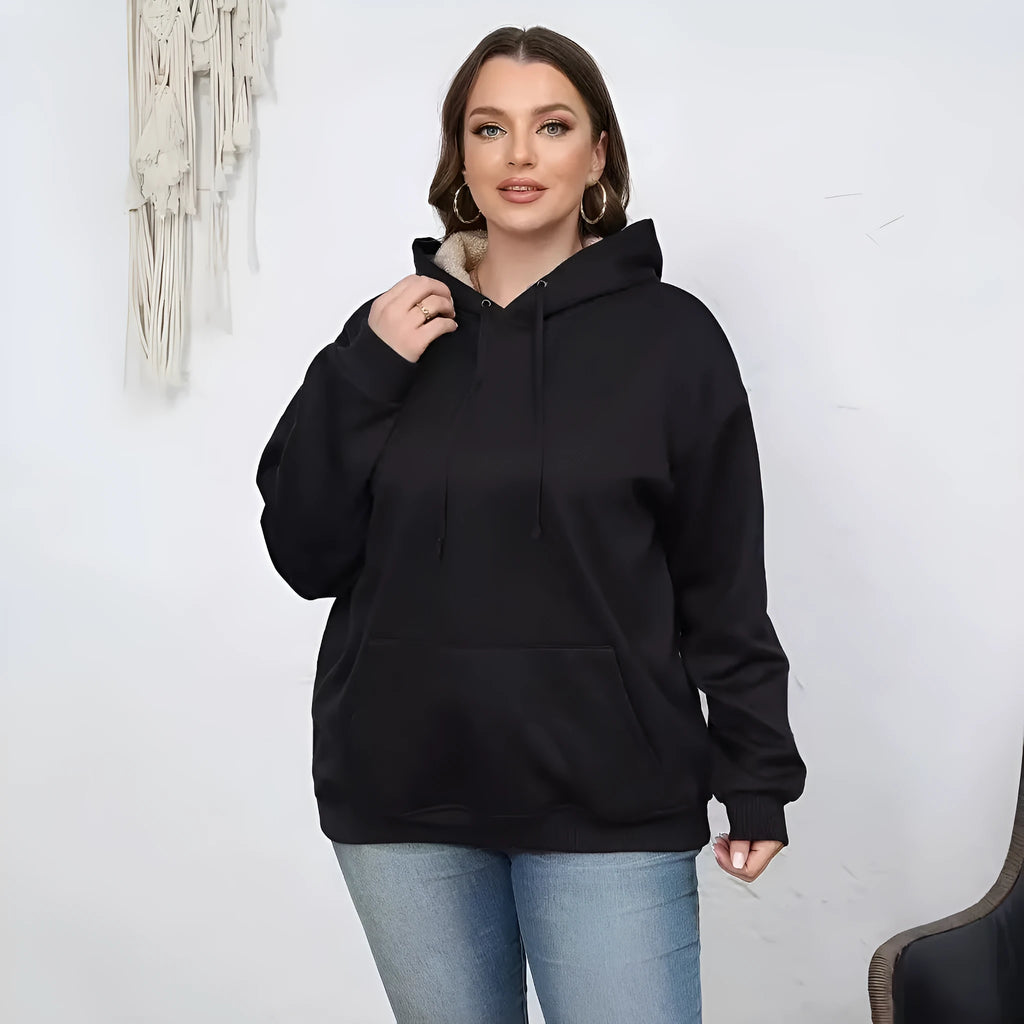 Women's black loose fit hooded sweater with pockets and long sleeves laid flat.