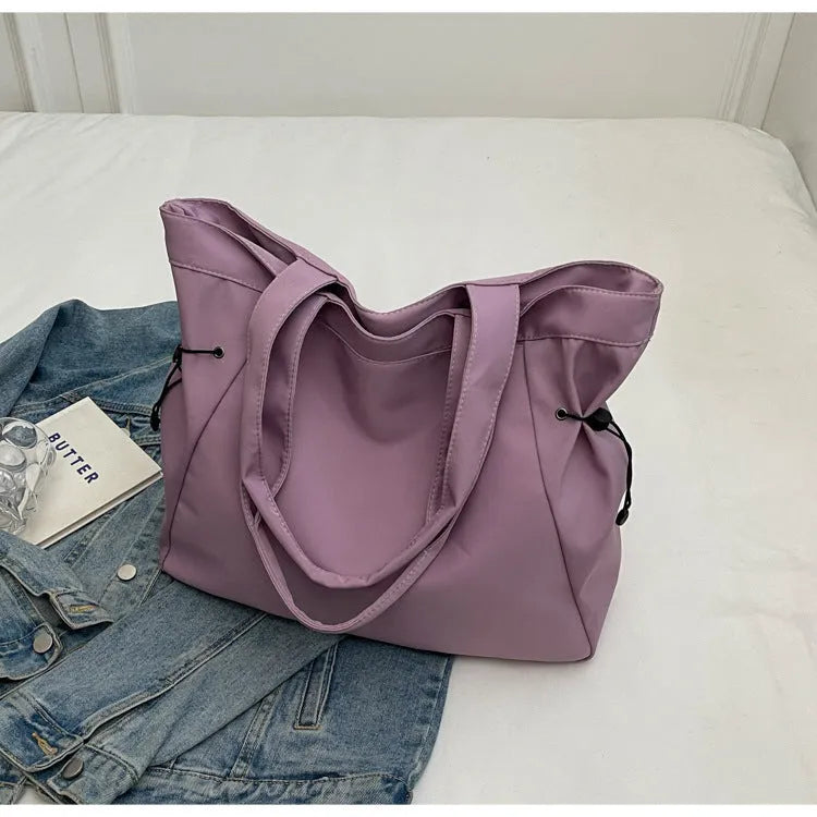 Soft Oxford cloth folding tote bag shown in multiple colours: black, brown, grey, and purple.