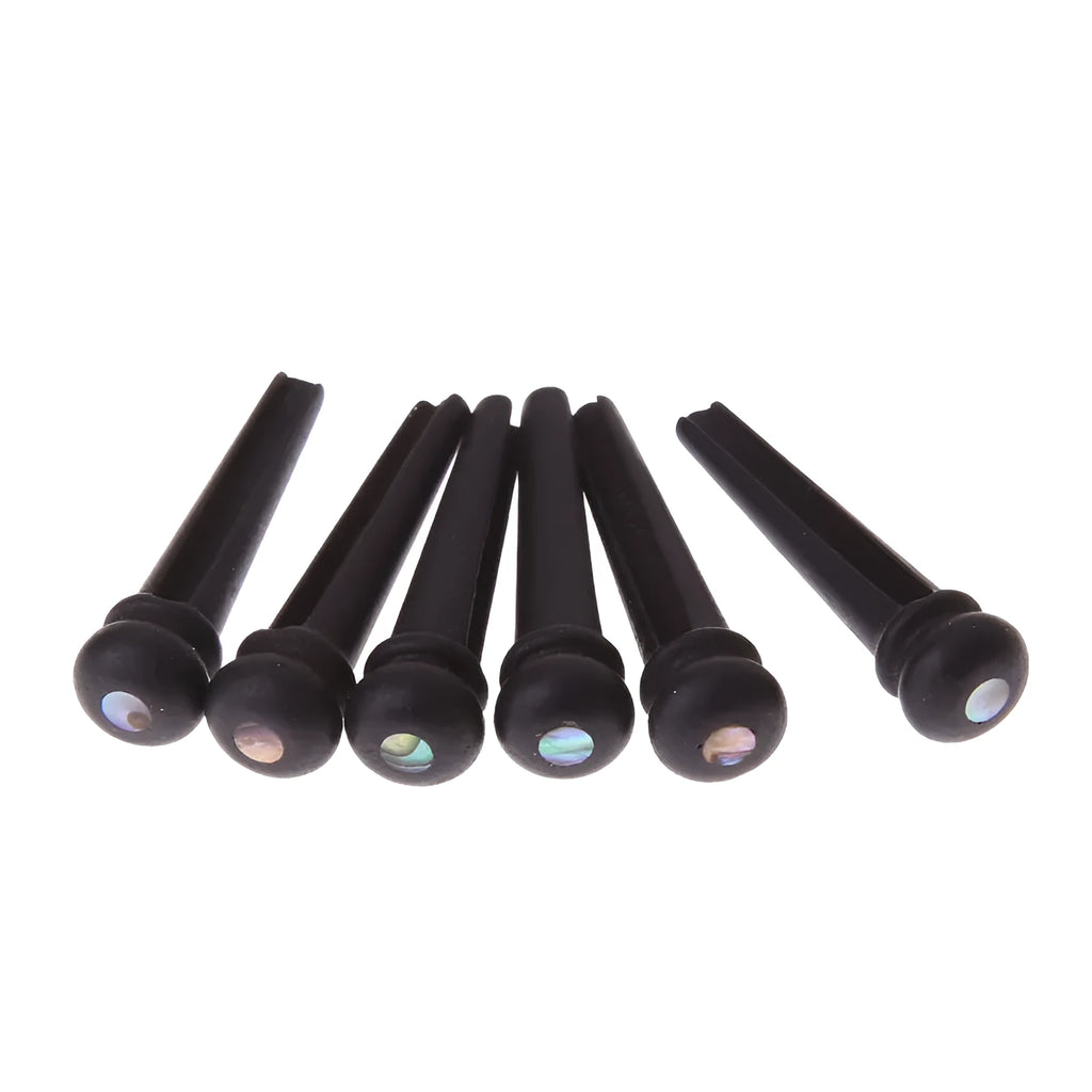 Six ebony folk guitar string nails with matt black finish and 5.3mm bayonet diameter