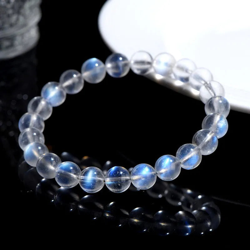 Natural cream body crystal bracelet with blue moonlight design showing minimalist unisex style