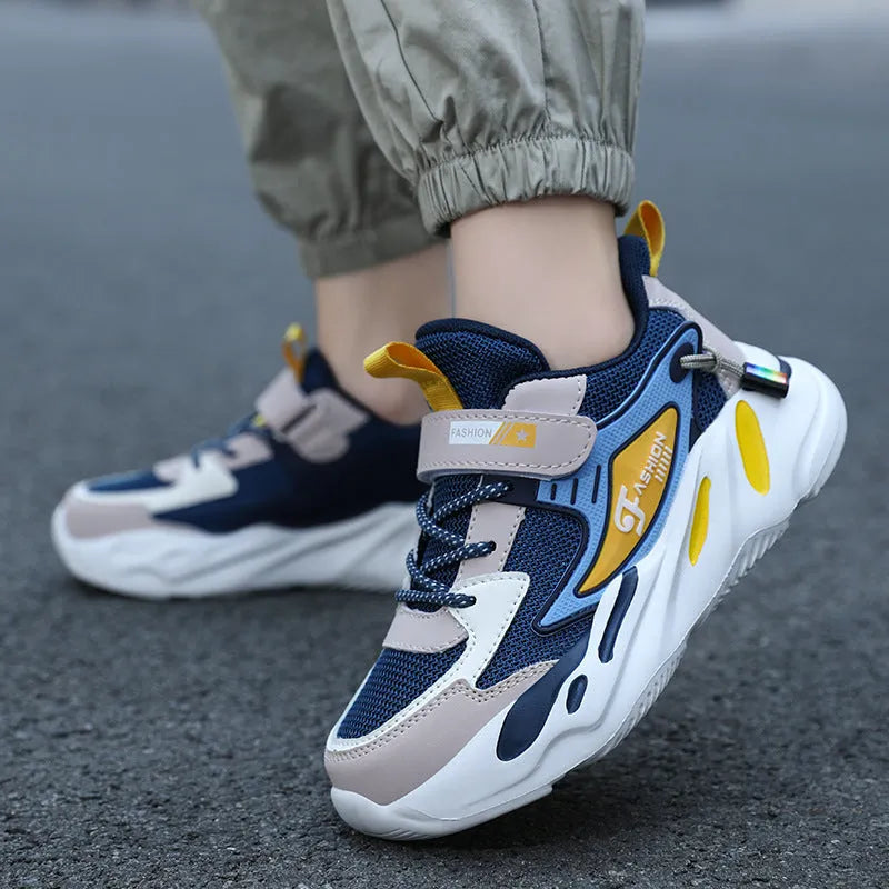 Boys' dark blue and light blue sports running shoes with Velcro strap and mesh upper.