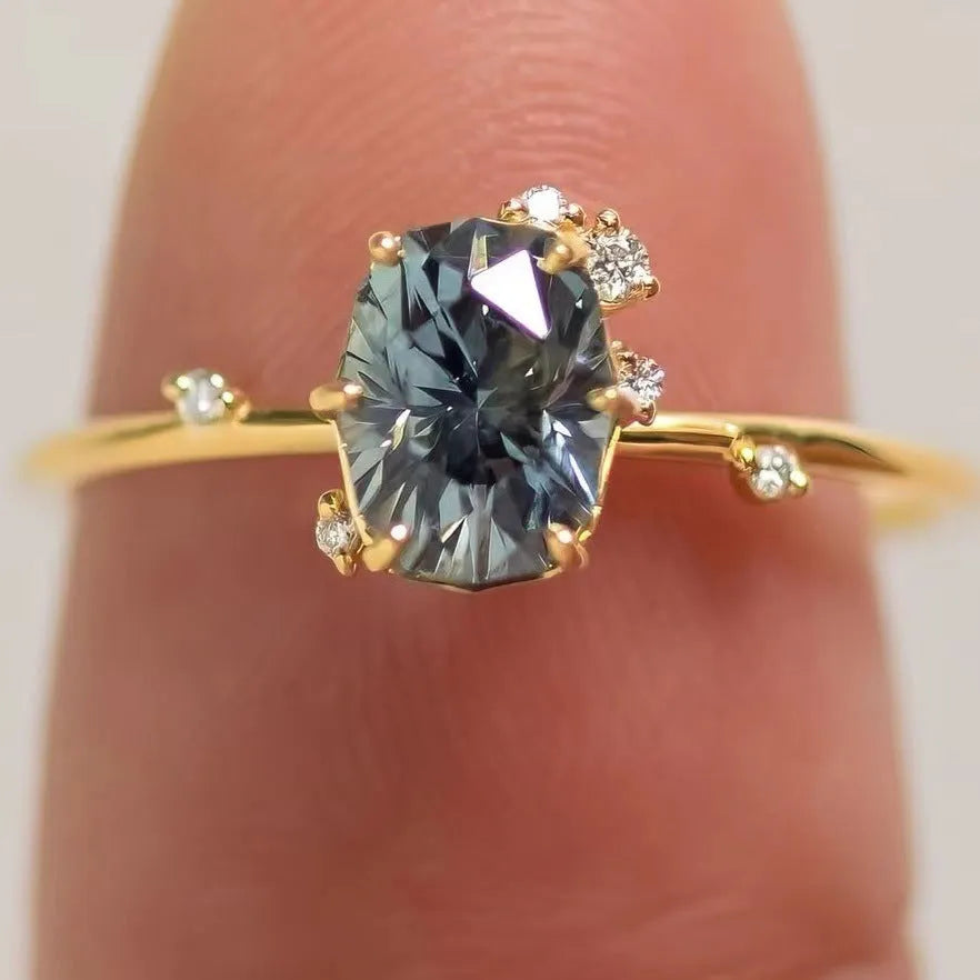 Gold plated women's ring with green zircon stones in floral design, shown as a pair for couple wear