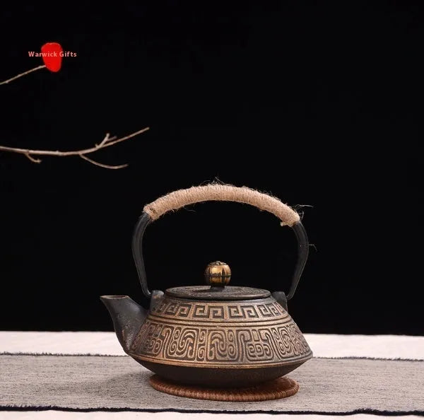 Japanese style cast iron teapot with 0.9 litre capacity shown in a bronze finish.