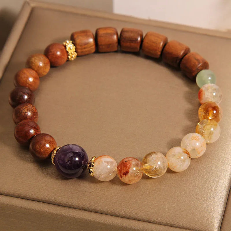 Women's bracelet with pineapple yellow tower crystal, ebony amethyst tones, pearl and rhinestone decorative elements