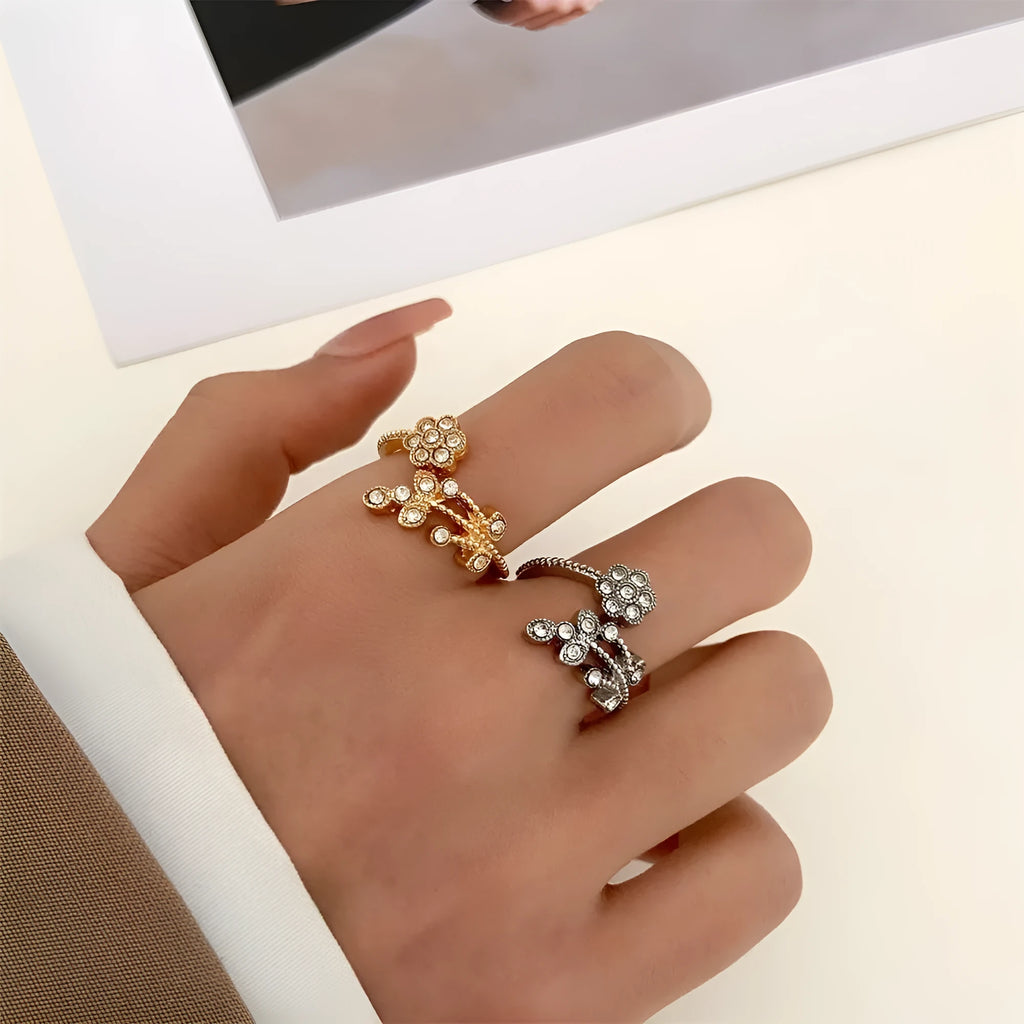 Women's copper open ring with a diamond-faceted flower and leaf design in gold and white colour options.