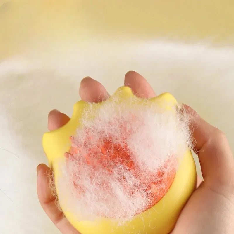 Pet bath massage brush with shampoo reservoir box in blue orange yellow colours measuring 9x8x5.3cm