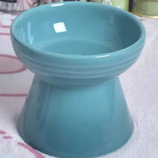 Black ceramic pet bowl with high neck protector and anti-tumble base design