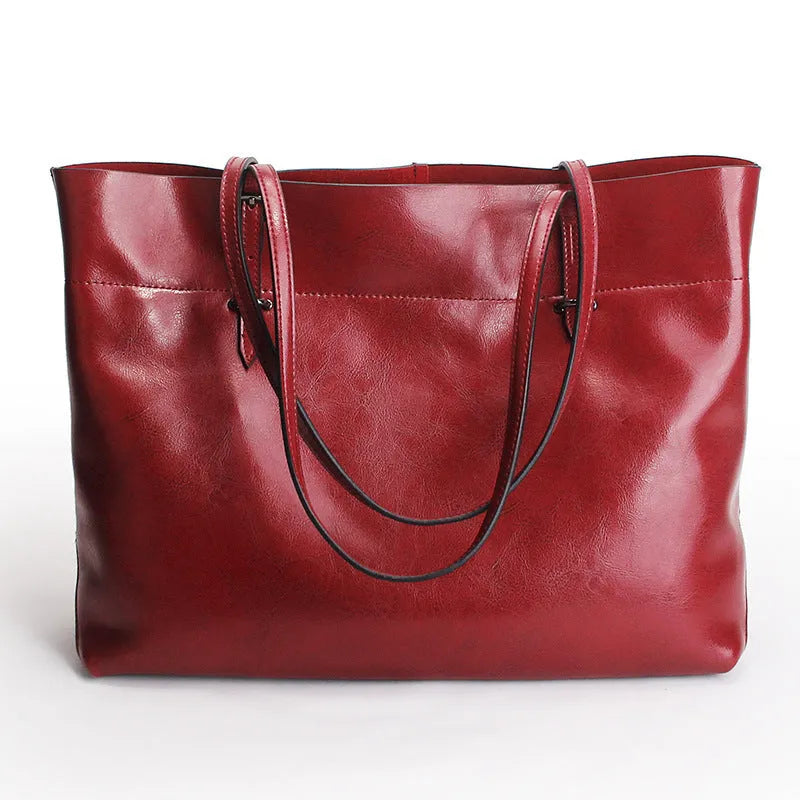 Women's wax cowhide leather crossbody handbag in five colour options showing two compartments and phone pocket.