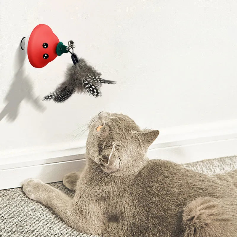 Red cat wand suction cup toy with retractable teaser on smooth surface, ABS construction, 41g weight