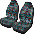 Pair of universal car seat covers in a cow spot leopard print retro pattern on a car front seat.