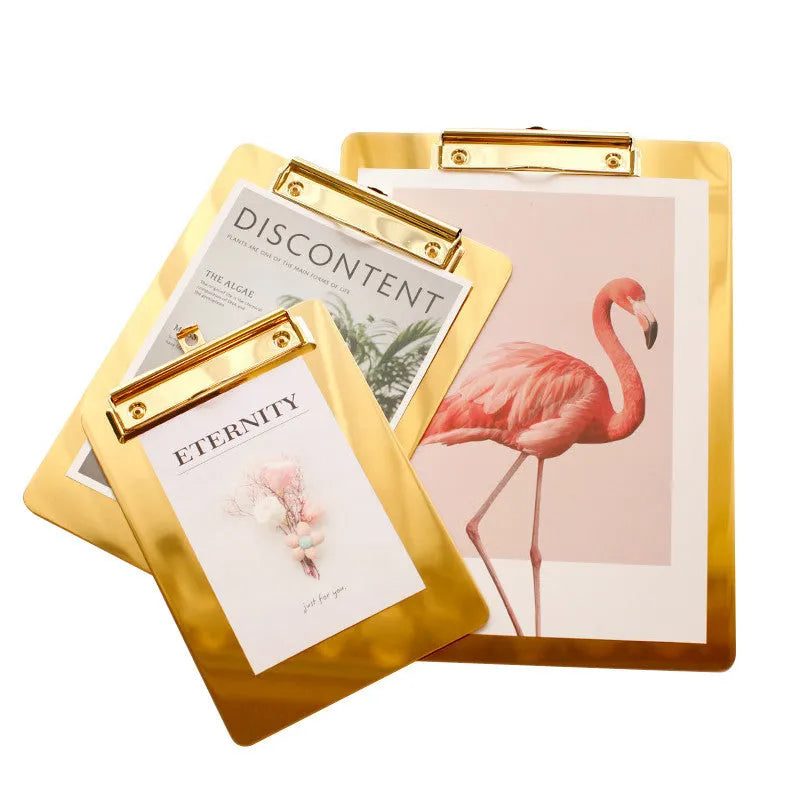 Gold metal-plated stainless steel folder board for office and study use on a flat surface.