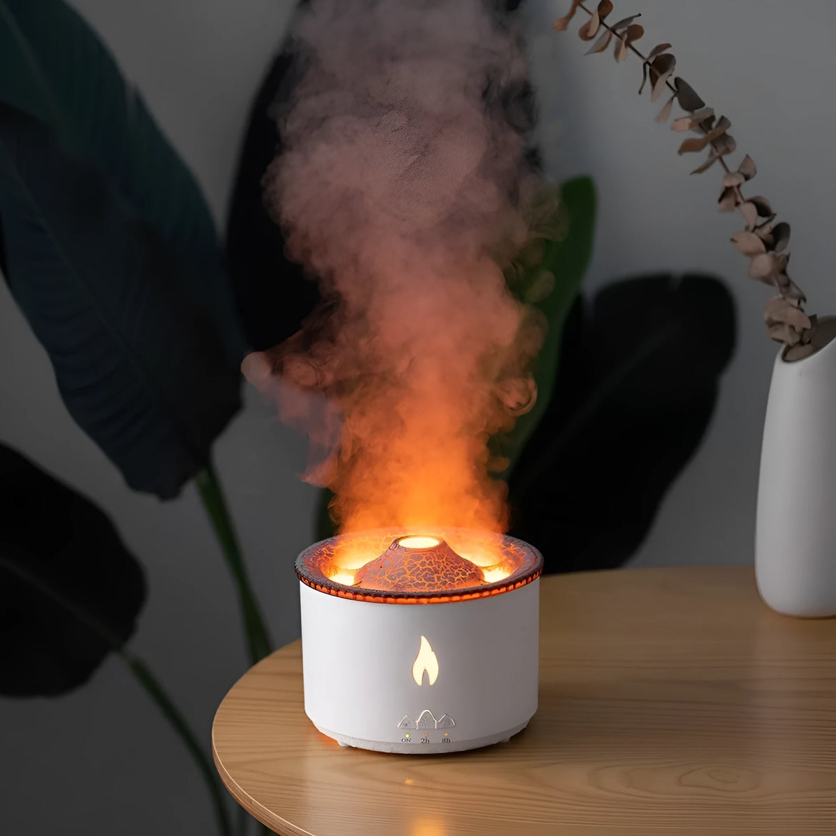 White round humidifier producing a two-colour blue and white volcanic spray ring of mist.