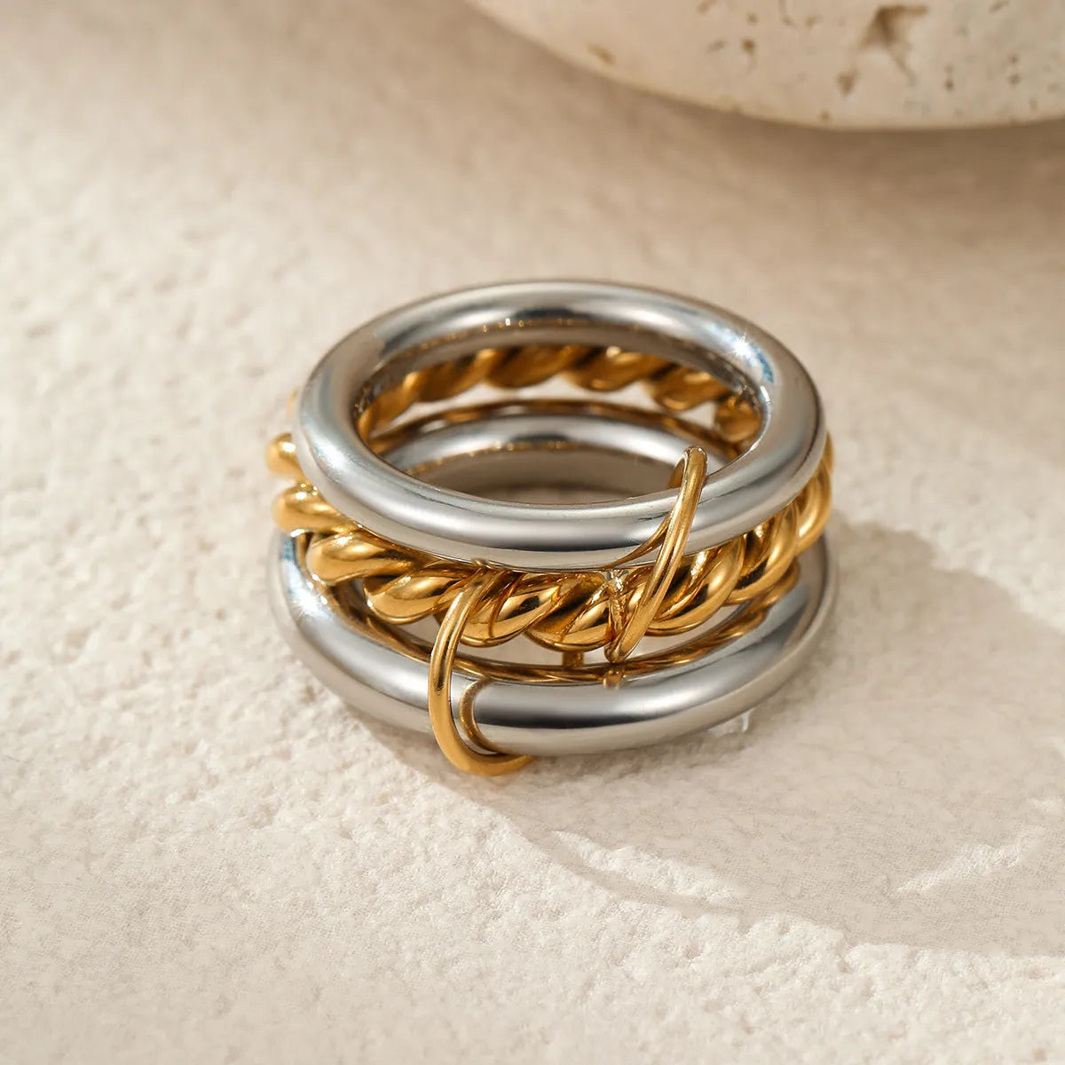 Stacked stainless steel ring set with 18K gold plating, exaggerated design for women.
