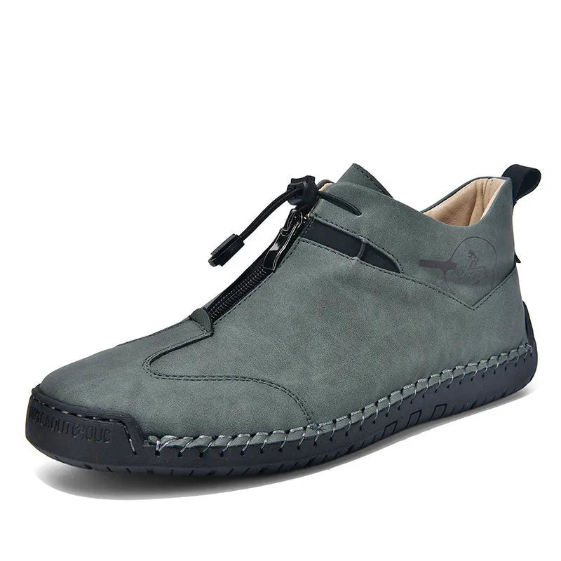 Men's black casual leather shoes with round toe, tall crown, and rubber sole.