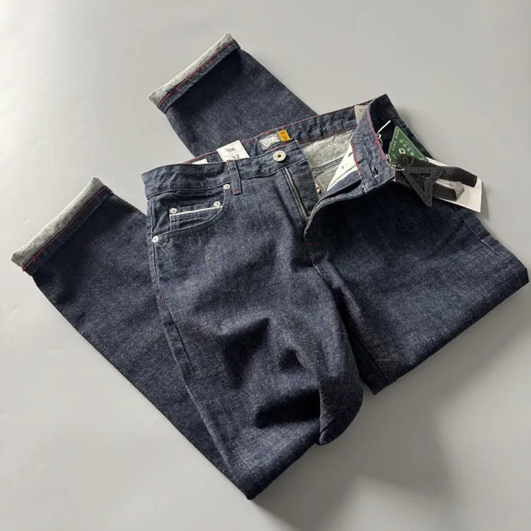 Men's primary colour American retro straight-leg denim trousers laid flat, showing mid-waist and full-length cut.