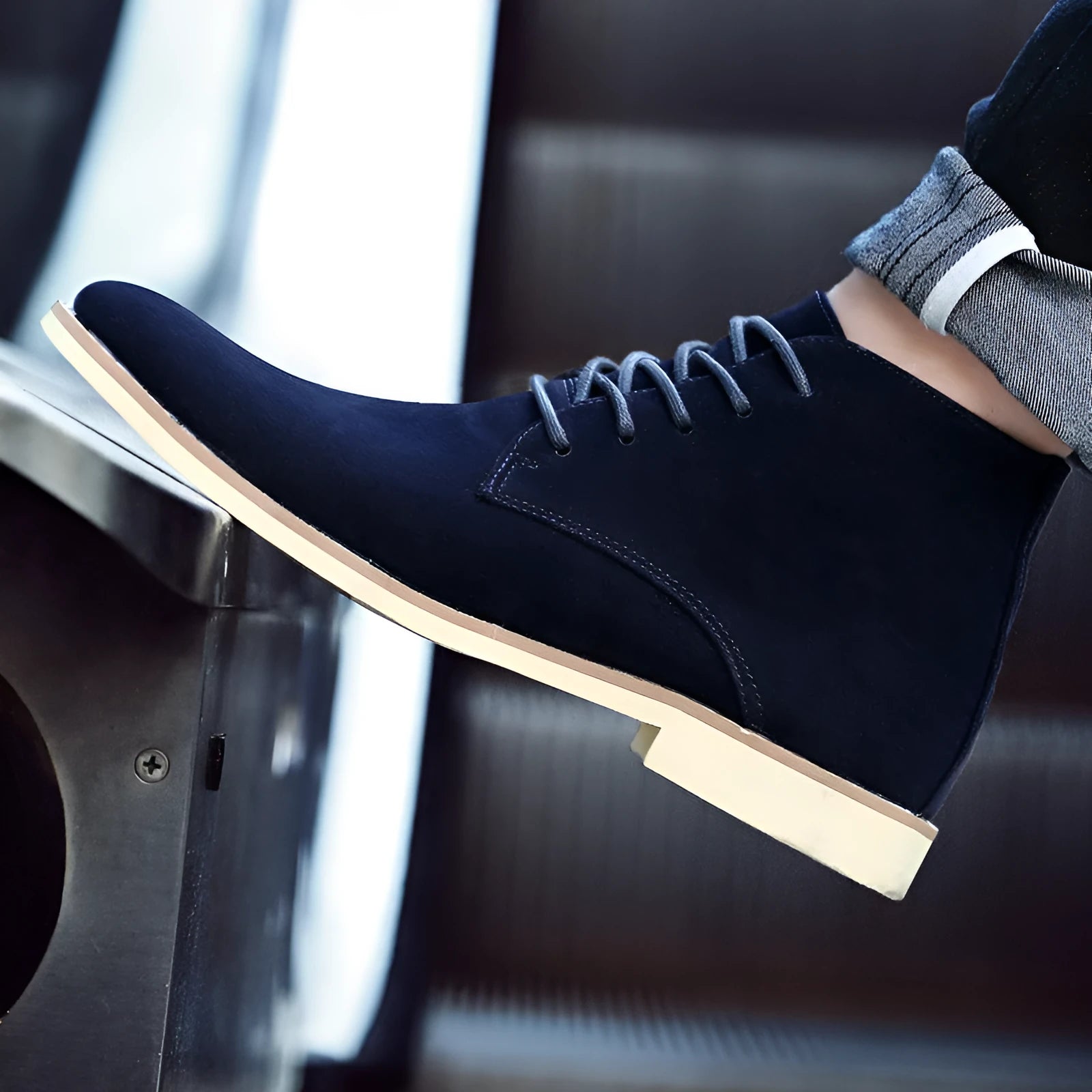 Large men's Martin boots in black with reverse suede vamp, pointed toe, front lacing, and thick heel
