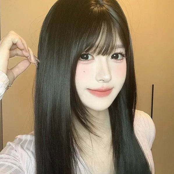 Dark brown long straight synthetic wig with bangs on wig head