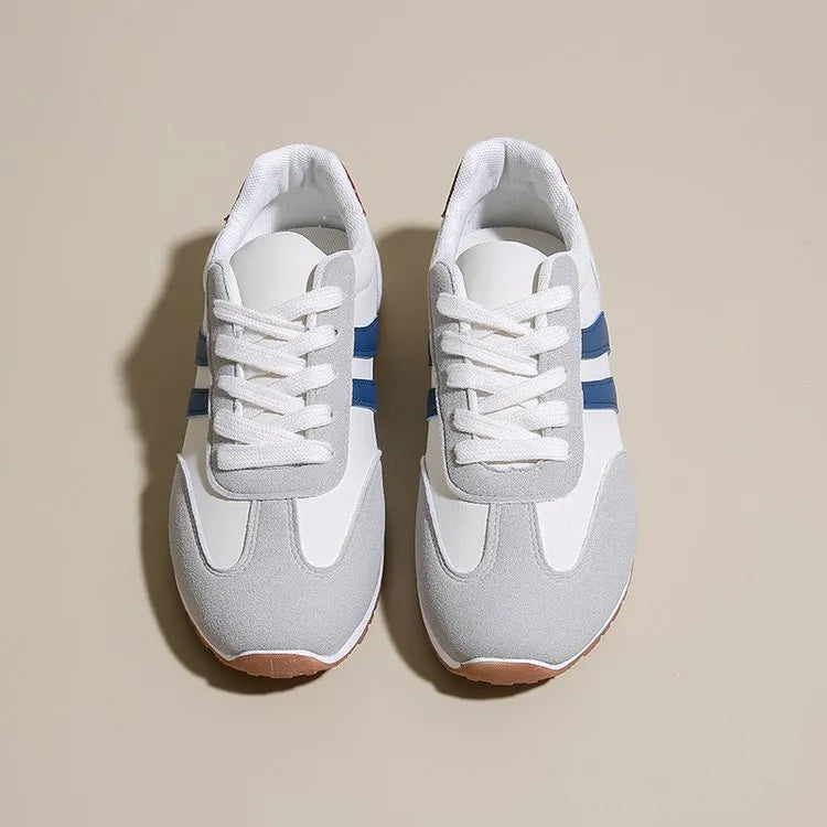 Blue and grey leisure sports shoes with Cortez stripes pattern, flat rubber sole, and round toe design