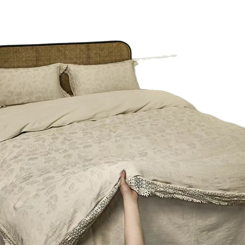 Cotton linen jacquard yarn-dyed washed four-piece bed sheet set in solid optic linen colour on a bed