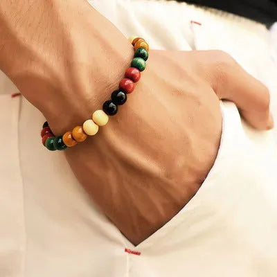 Natural stone bead bracelet with lava stones on a wrist, showing ethnic charm style and adjustable 18cm length.