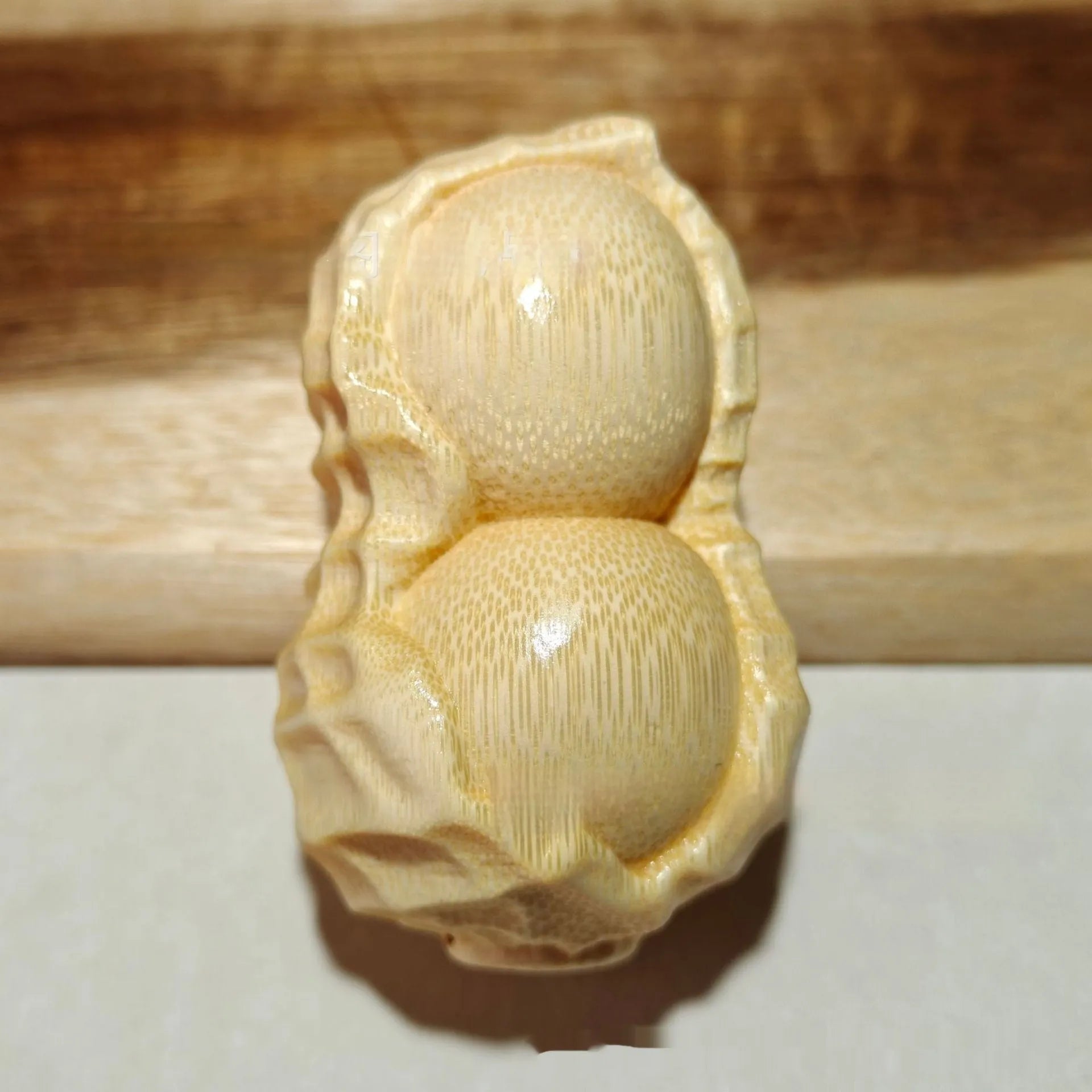 Natural bamboo peanut ornament with modern simplicity design for multiple gifting occasions