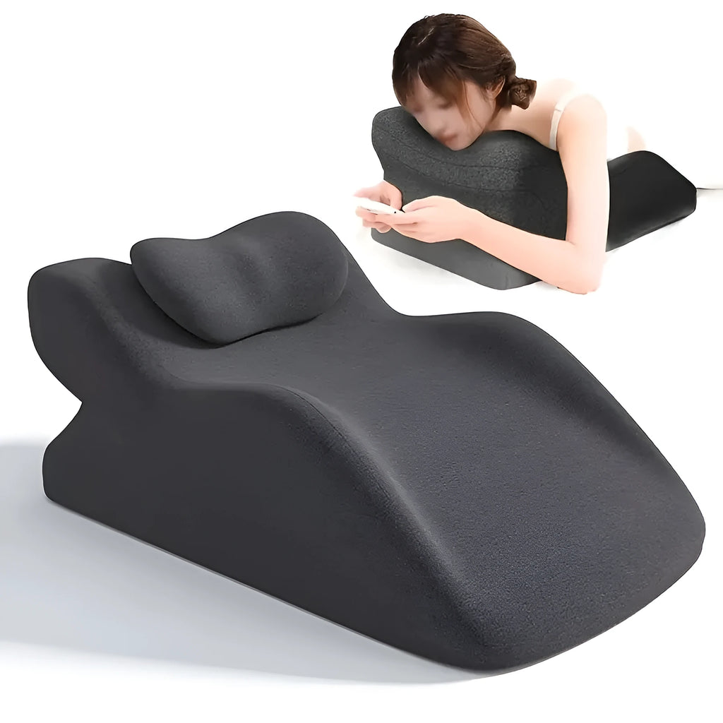 A blue stomach sleeper pillow on a bed, designed for lying face down.