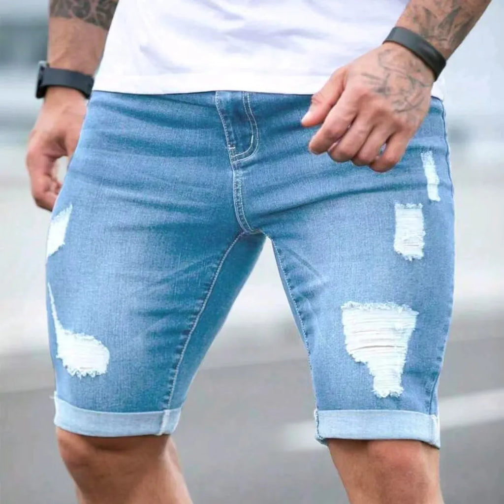 Sky blue men's denim shorts with a multi-hole design and low waist.