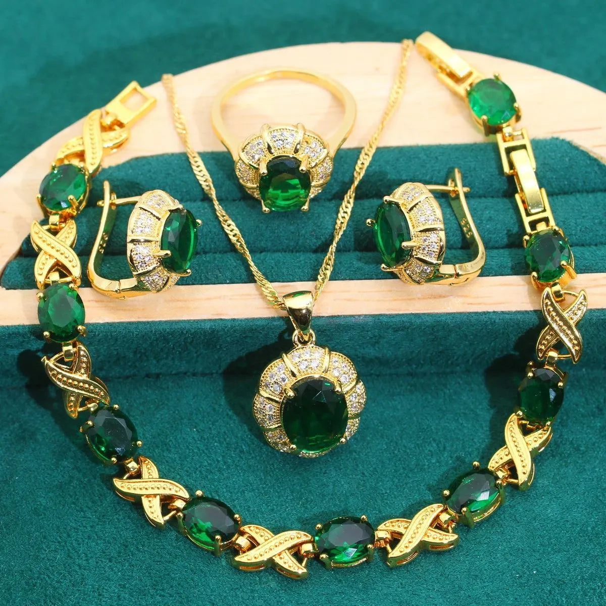 Complete 18k gold plated jewellery set showing necklace, earrings, ring and bracelet with multi-coloured cubic zirconia stones.