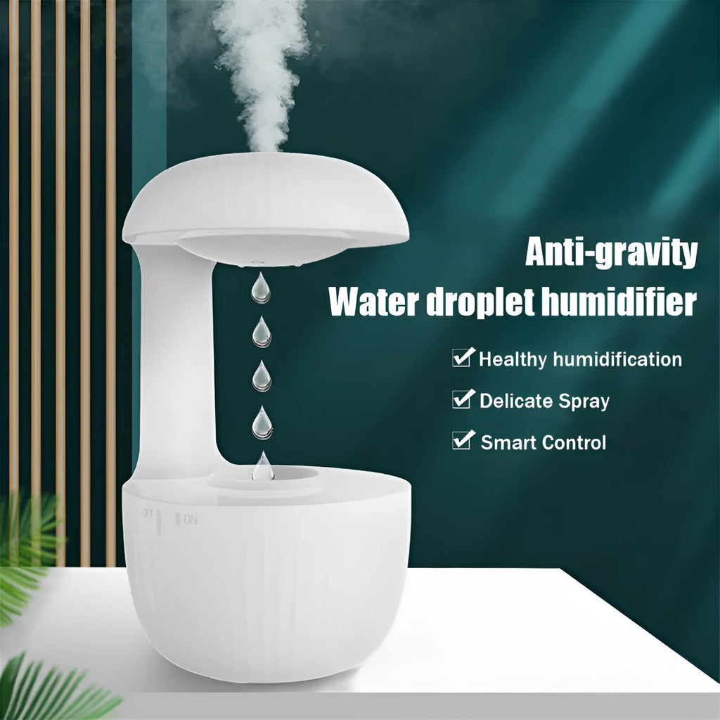 White anti-gravity air humidifier with levitating water drops and USB cable on a desk