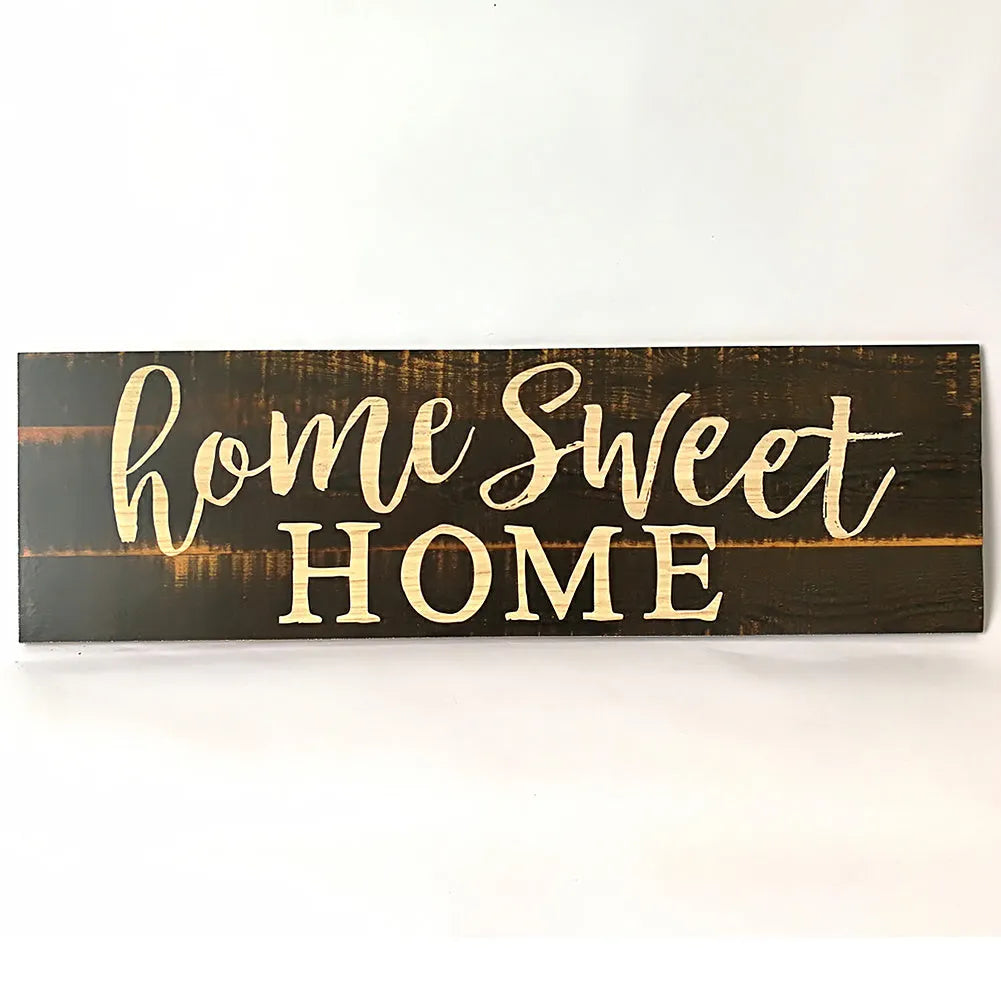 Carved wood Home Sweet Home hanging ornament in black, showing dimensions of 40cm wide.