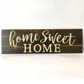 Carved wood Home Sweet Home hanging ornament in black, showing dimensions of 40cm wide.