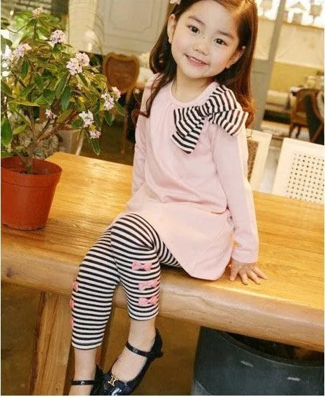 Girls' pink cotton two-piece clothing set shown in sizes 110cm, 120cm, 130cm, and 140cm