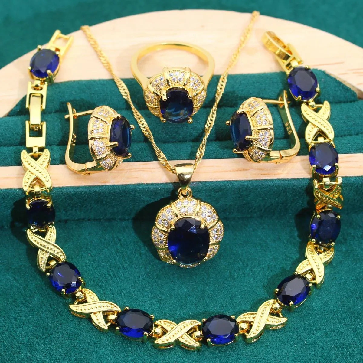 Complete 18k gold plated jewellery set showing necklace, earrings, ring and bracelet with multi-coloured cubic zirconia stones.