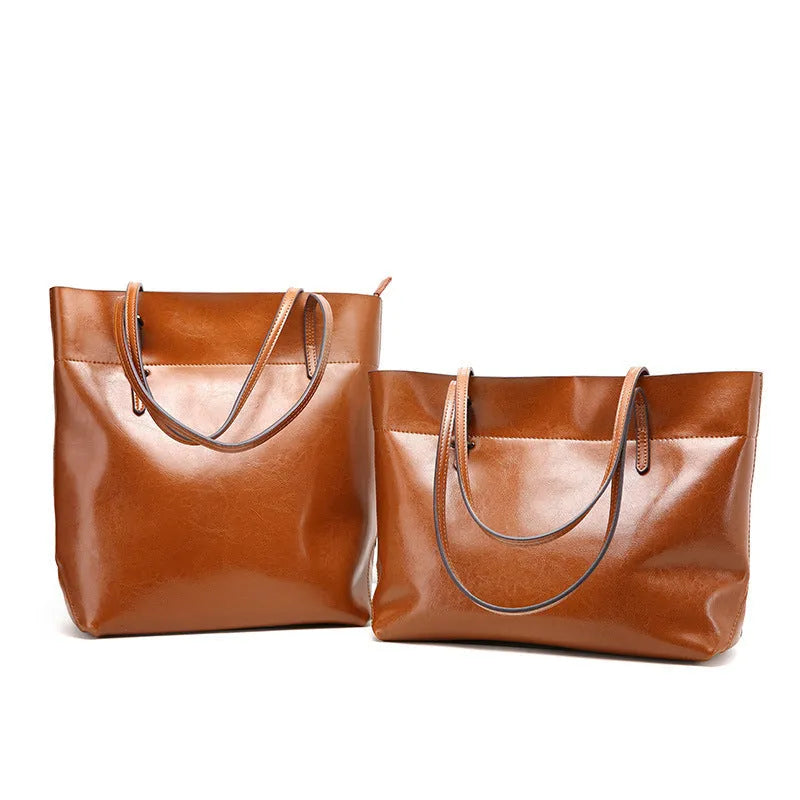Women's wax cowhide leather crossbody handbag in five colour options showing two compartments and phone pocket.