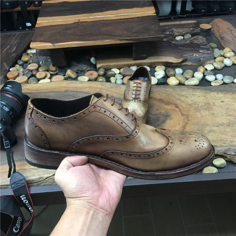 Light brown men's vintage engraved leather lace-up shoes with round toe.
