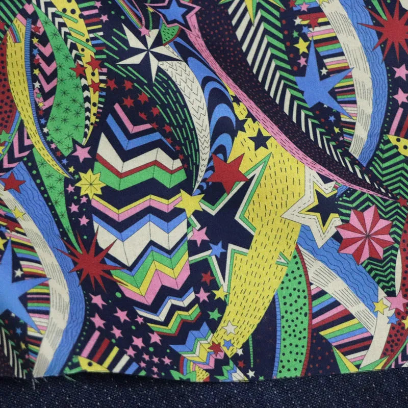 Blue cotton fabric with digitally printed plant and flower design showing 145cm width
