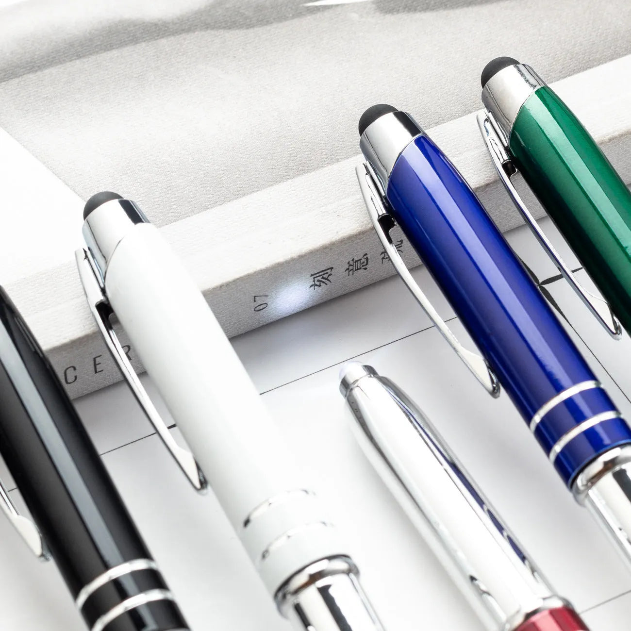 Metal capacitive stylus LED ballpoint pen in five colour options showing bullet pen head