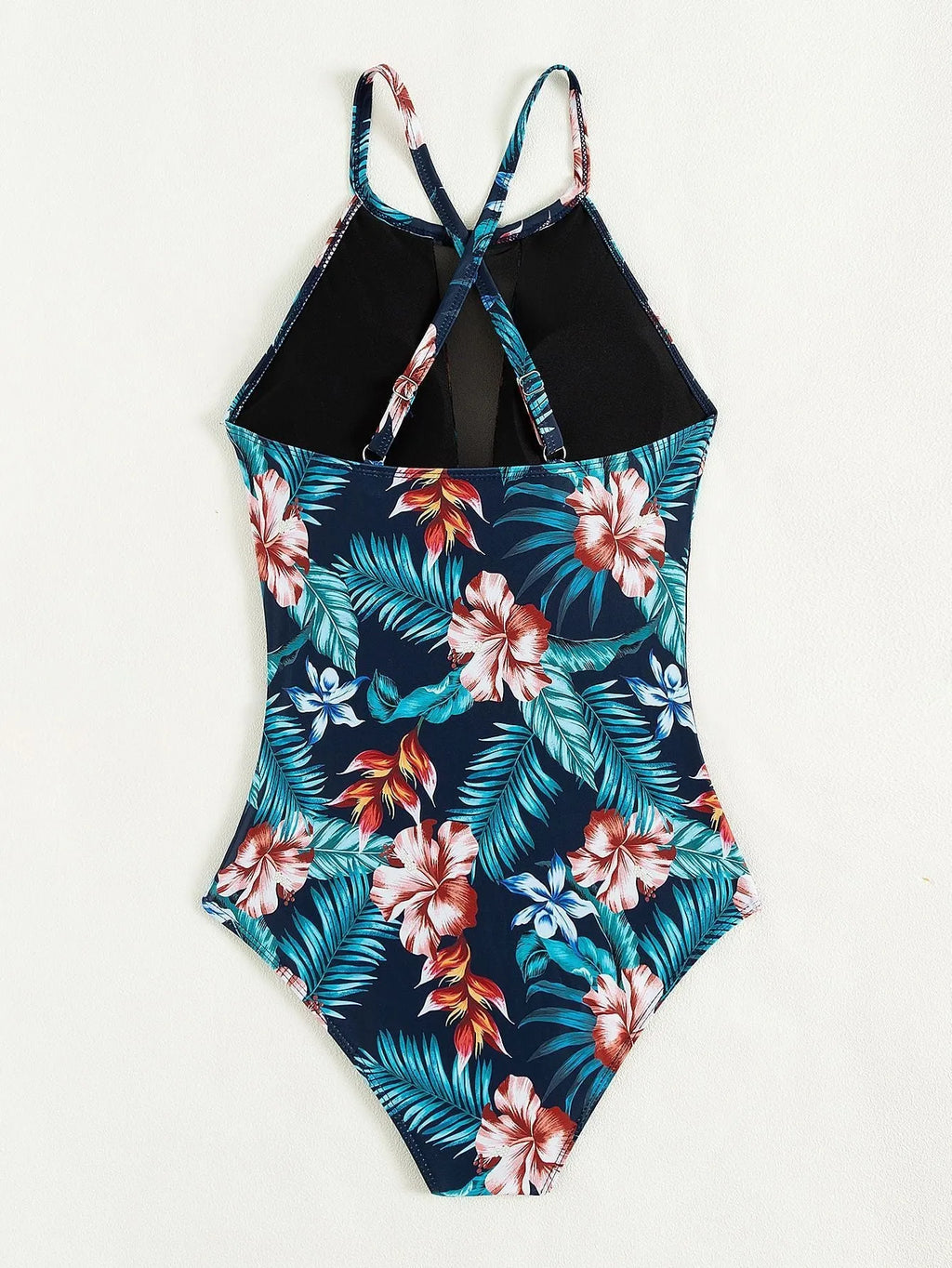 Women's deep V neck one-piece swimsuit in a printed pattern with polyester lining.
