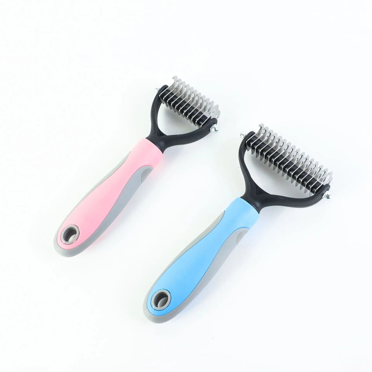 Double-sided stainless pet brush for dogs and cats with button hair removal and non-slip grip, blue or pink