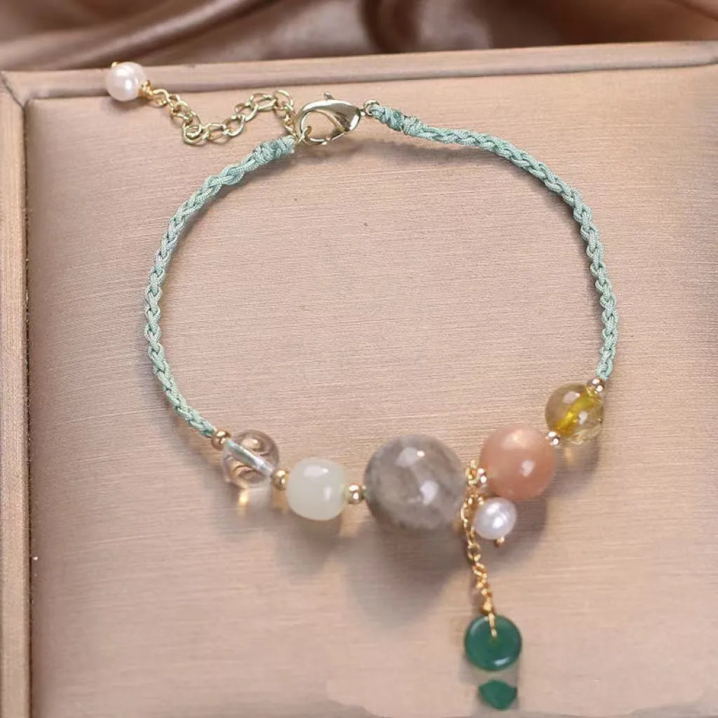 Hand-woven women's bracelet with peace buckle, crystal beads, and sequins in red, green, or blue.