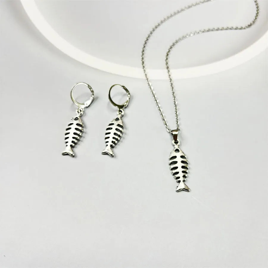 Fishbone motif pendant necklace and matching earrings set in retro-style alloy jewellery with adjustable chain.