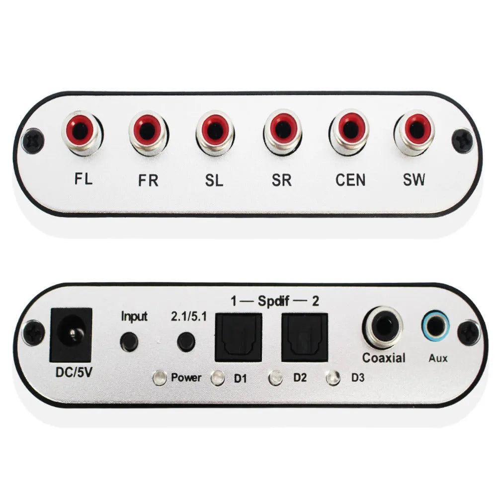 Black DTS Dolby AC-3 audio decoder unit with optical and coaxial inputs on a desk.