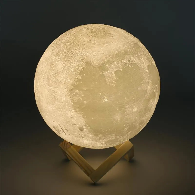 3D printed white moon lamp with detailed craters on a wooden stand, showing touch ring at base